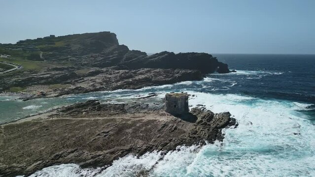 La Pelosa old sighting tower on rocky islet, Sardinia. Aerial