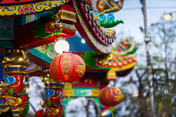 Decorative red lantern decoration for Chinese New Year Festival At night with the Chinese alphabet Blessings written on it Is a Fortune blessing compliment in chinese shrine,Is a public place Thailand