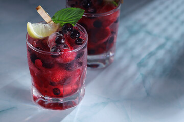 Cold refreshing drink with fresh berry and ice