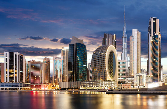 Panaroma of Dubai skyline with Burj khalifa and other skyscrapers at night from Al Jadaf Waterfront; UAE