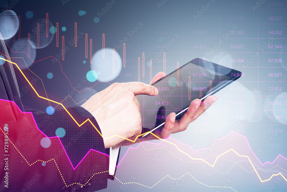 Poster close up of businessman hand using tablet with pink crisis business and forex chart on blurry backgr