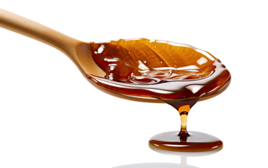 Teriyaki Sauce flowing through a Teriyaki spoon on a White or Clear Surface PNG Transparent Background.