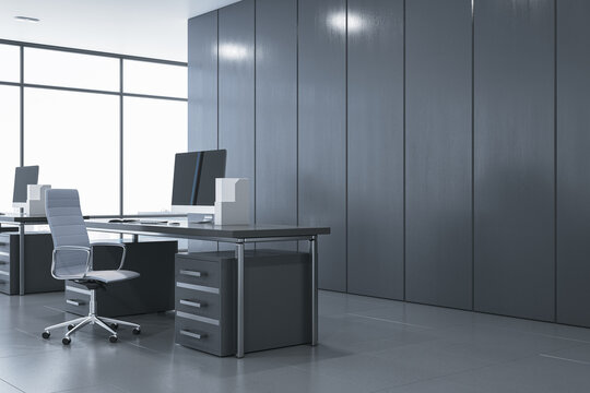 Side view of modern gray office interior with furniture, equipment and window with daylight. 3D Rendering.