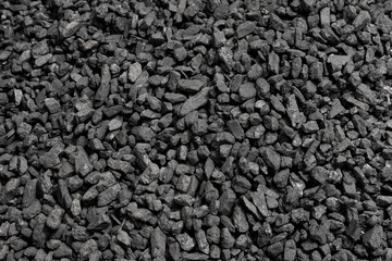 Black coal, hard coal. Background, texture. Energy crisis. Soft focus.