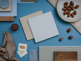 Obraz na płótnie Canvas Creative flat lay composition of interior designer moodboard with textile and paint samples, panels and tiles. Color palette. Copy space. Template. 
