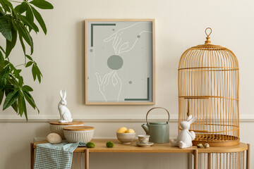 Cozy composition of easter living room interior with mock up poster frame, wooden sideboard, easter bunny, stylish bowl, wooden cage, colorful easter eggs and personal accessories. Home decor Template