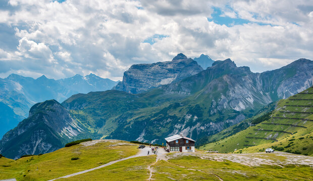Alps panoramic picturesque landscape in summer, Stubai Alps, mountain hut and Habicht Peak 3,277 m in distance, view from Blaser mountain, Tyrol, Austria.