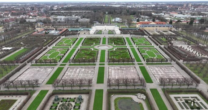 Touristic baroque herrenhauser gardens in Hannover, Germany. City park, flora and fauna in the city. Green city, touristic attraction and landmark. Birds eye aerial drone view.