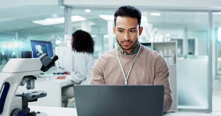 Man, laptop and lab for futuristic medicine or science or online internet for research, microscope...