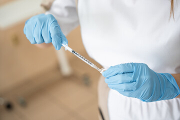 Close-up of d doctor's hand filling anesthesia before injection