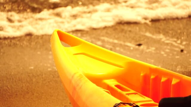Kayak, Beach, Water - Colorful kayaks on sandy shore with glistening water backdrop on sunny day inviting exploration. Summer holiday vacation and travel concept