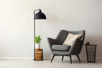 Minimalist monochrome living space with a single, comfortable armchair and a floor lamp for reading
