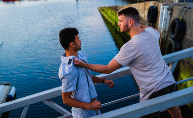 Fight at the sea port with a caucasian man threatening a muslim man