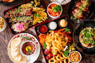 variety of restaurant food dishes on table