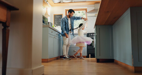 Support, love and ballet girl bonding with father in a kitchen together, excited and playing as a dancer pr ballerina. Tutu, dad and man dancing with kid with motivation or happiness in house or home