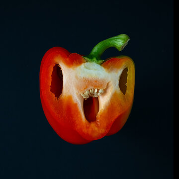 Creepy Halloween pepper face with big eyes and mouth