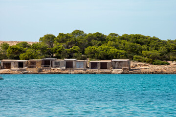 Fototapeta na wymiar Casetas / fisherman's huts along the coast of Ibiza, Punta de sa Pedrera