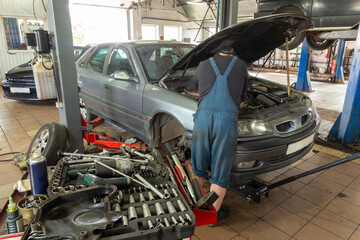 A Selective focus of mechanic's toolbox with tools in drawers,