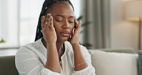 Headache, stress and young black woman in the living room of her modern apartment on weekend. Burnout, mental health and sick African female person with migraine for illness in lounge at home. - obrazy, fototapety, plakaty