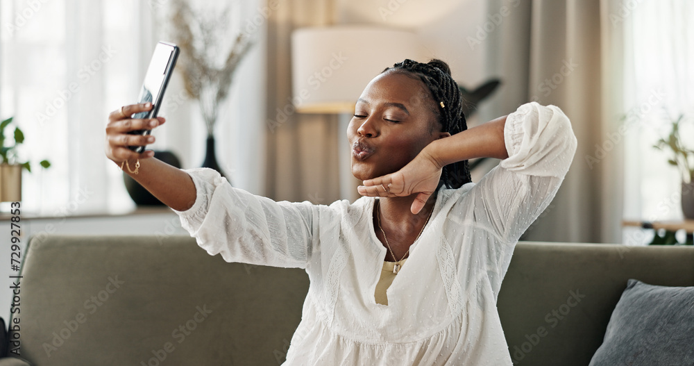 Sticker Smile, selfie and black woman with peace sign, funny face and relax on sofa in living room. V hand, picture and happy African person or influencer at home on couch on social media with tongue out