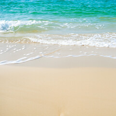 Fototapeta na wymiar Beautiful Soft blue ocean wave on fine sandy beach