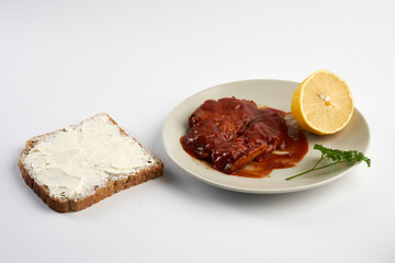 Mackerel on a plate with tomato sauce