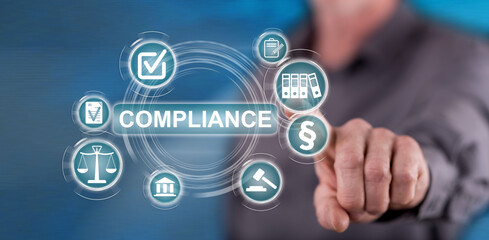 Man touching a compliance concept