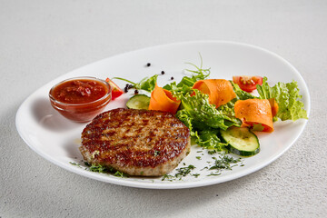 Juicy beef steak with a side of fresh vegetable salad, perfect for healthy menus and food blogs