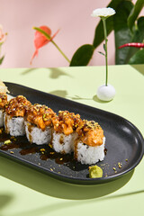 Salmon Tartare Sushi Roll Adorned with Unagi Sauce and Pistachio. Suitable for upscale dining and flavor fusion concepts