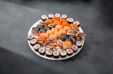 Assorted sushi and maki rolls platter with tuna, salmon, and eel, perfect for a Japanese cuisine experience