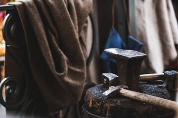 Moscow seasons. A traditional craft. Blacksmith's work with metal. Hammer and anvil. Russian traditions. Moscow. Russia