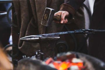 Moscow seasons. A traditional craft. Blacksmith's work with metal. Hammer and anvil. Russian...