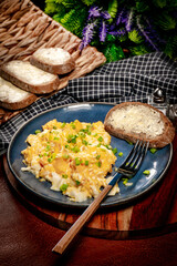 Scrambled eggs with onion and chives.