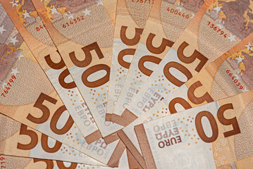 Background of fifty euros banknotes in the shape of a circle