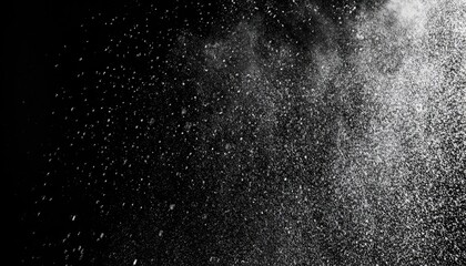 Abstract splashes of water on a black background. Freeze motion of white particles. Rain, snow overlay texture