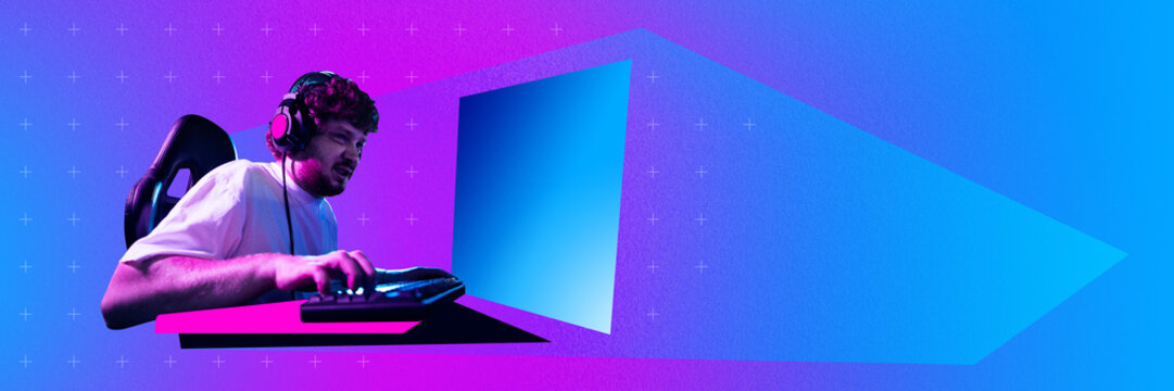 Emotional and concentered young man, streamer, gamer during game tournament, playing on computer against gradient neon background. Concept of gaming culture, online gaming, streaming