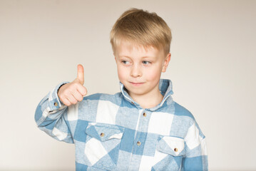 boy showing thumbs up