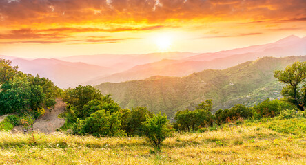 summer scenery mountain view from a highland hill to a beautiful sunset.