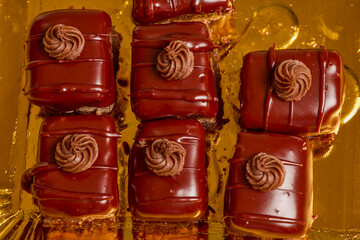 Fresh Amandina cakes on a paper plate.