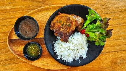 Roasted pork on rice with soup and sauce