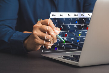 Businesswoman planning on a digital calendar and effective task management.