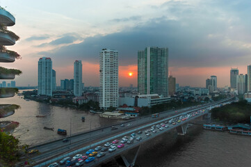 Fototapeta na wymiar Beautiful sunset of skyscrapers, coast and traffic jams of the city of Bangkok (Thailand)