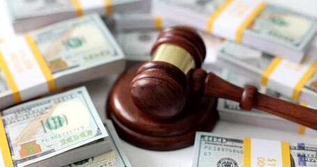 Judicial gavel on stacks of American money. Responsibility for economic crimes and crimes in customs sphere