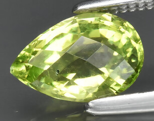 natural green peridot olivine gem on the background