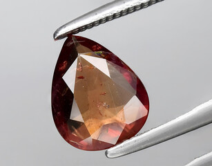 natural brown sapphire gem on the background