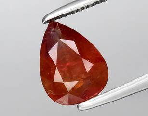 natural brown sapphire gem on the background