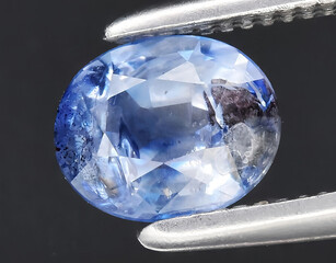 natural blue sapphire gem on the background