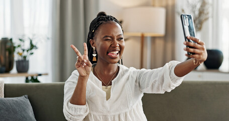 Smile, selfie and black woman with peace sign, funny face and relax on sofa in living room. V hand,...