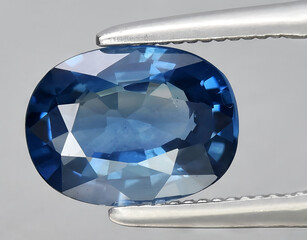 natural blue sapphire gem on the background