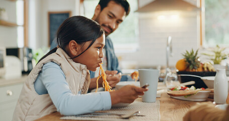 Father, kids and a girl eating spaghetti with her family in the dining room of their home together...